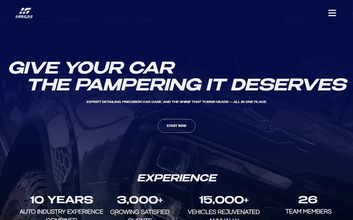 Hakum Auto Care dark hero with vehicle photography and service stats